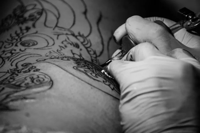 tattoo, ink, tattoo artist, body drawing, drawing, body, artist, studio, machine, skin, professional, master, hand, creative, create, work, process, gloves, client. OSHA Bloodborne Pathogens Tattoo Studio Guide