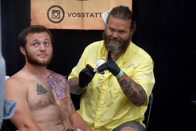 Tattooer Jason Voss from Michigan - quite the tattoo artist. His client is a bit furry. Tattoo studio operations: what to keep and what to drop